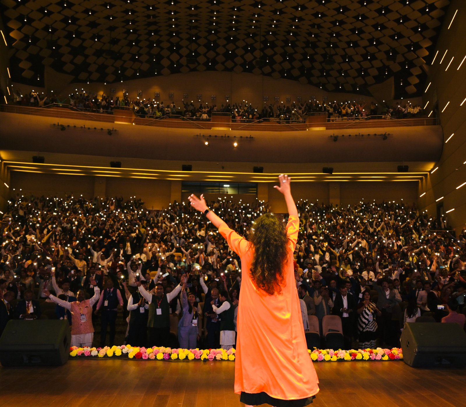 Himani on stage with audience