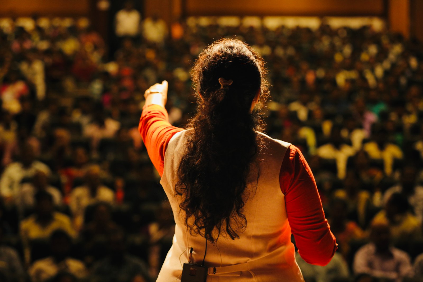 Himani speaking to a packed audience